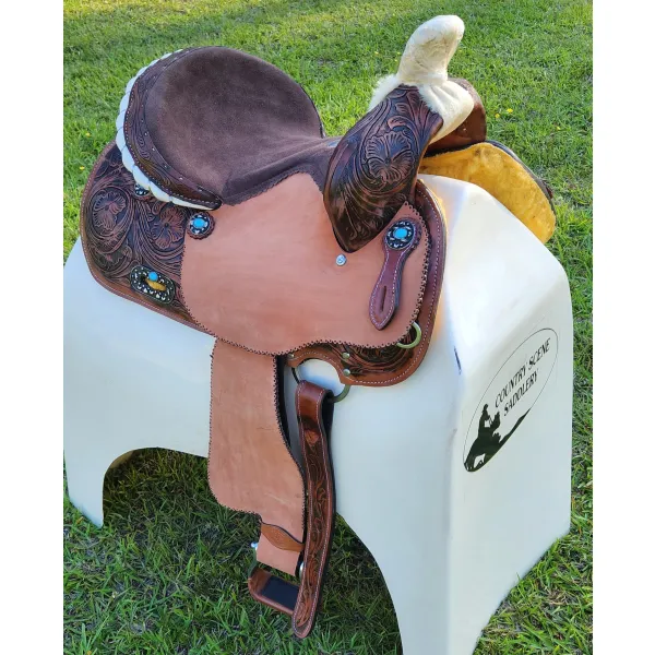 14", 15", 16" Double T barrel saddle with silver laced tan rawhide cantle, dot border on rough out fenders and jockeys.