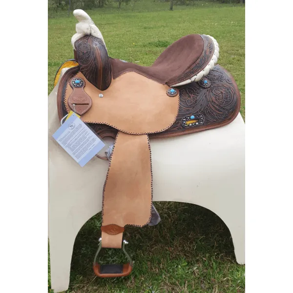 14", 15", 16" Double T barrel saddle with silver laced tan rawhide cantle, dot border on rough out fenders and jockeys.