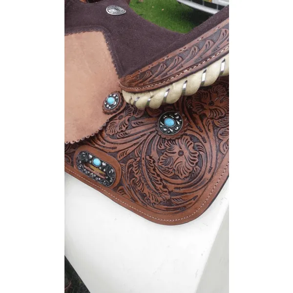 14", 15", 16" Double T barrel saddle with silver laced tan rawhide cantle, dot border on rough out fenders and jockeys.