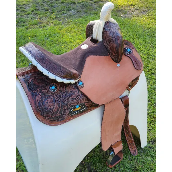 14", 15", 16" Double T barrel saddle with silver laced tan rawhide cantle, dot border on rough out fenders and jockeys.