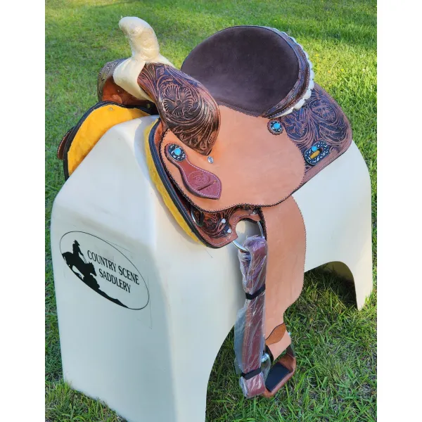 14", 15", 16" Double T barrel saddle with silver laced tan rawhide cantle, dot border on rough out fenders and jockeys.