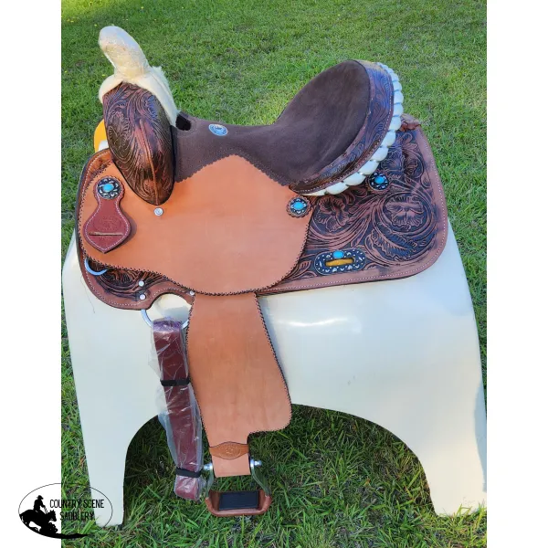 14", 15", 16" Double T barrel saddle with silver laced tan rawhide cantle, dot border on rough out fenders and jockeys.