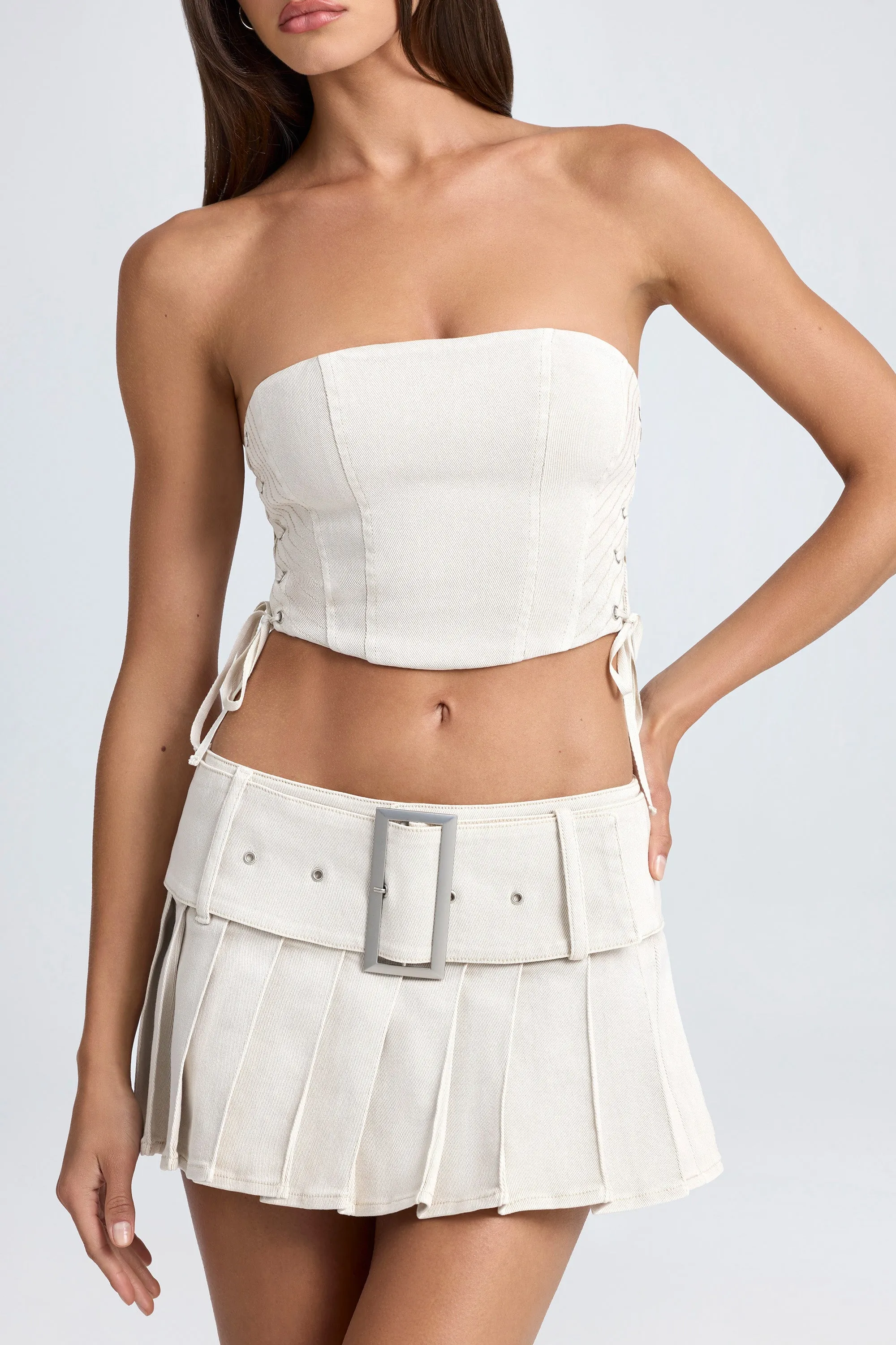 Belted Pleated Low-Rise Micro Mini Skirt in Ecru