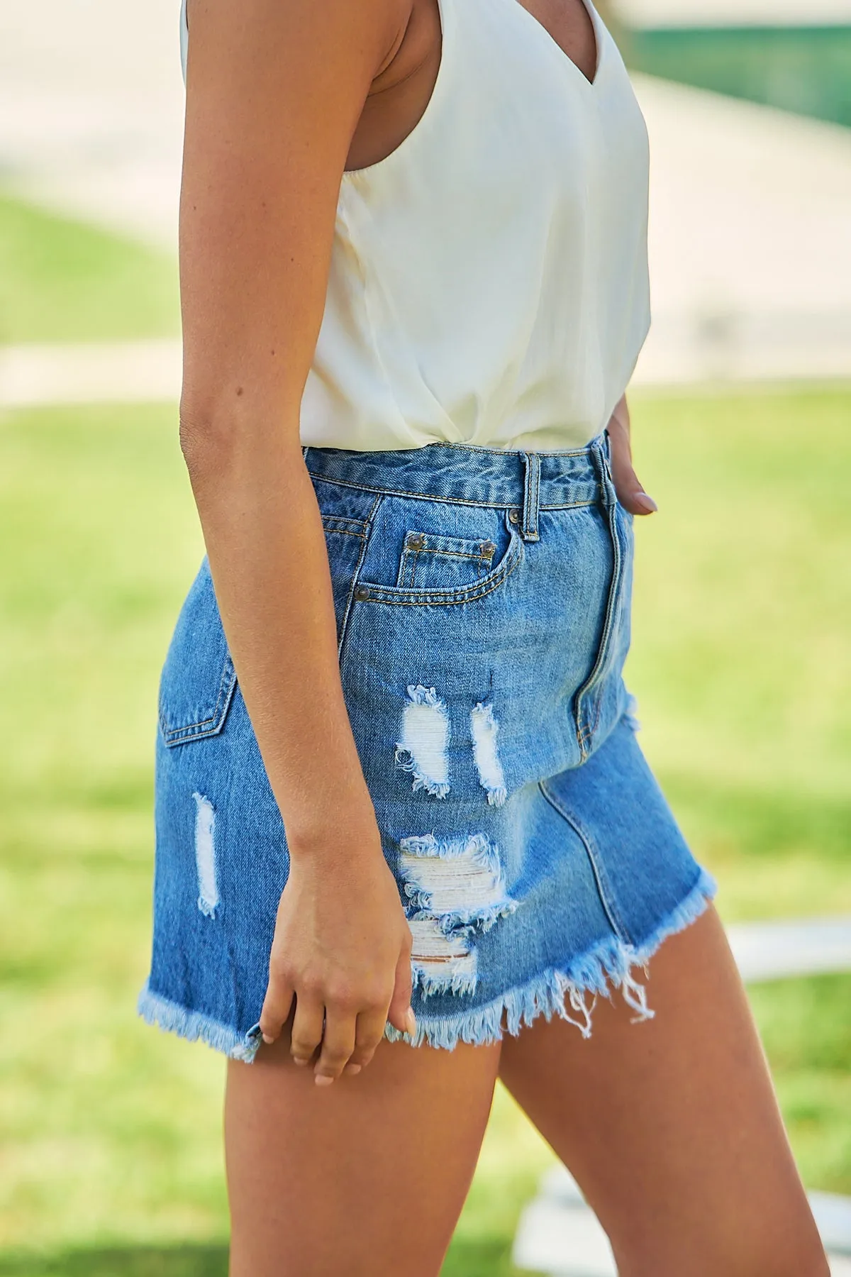 Ripped and Frayed Denim Mini Skirt